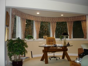 A cornice on an odd shaped window.