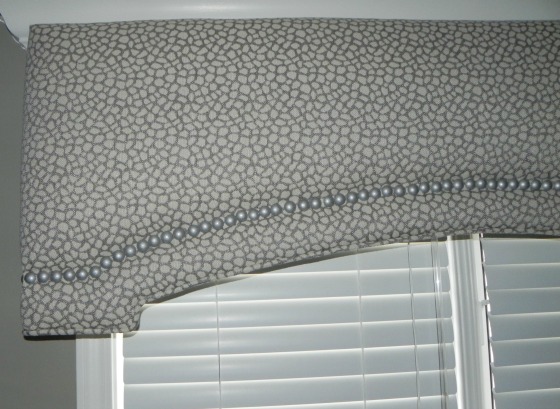 Cornice with nailheads